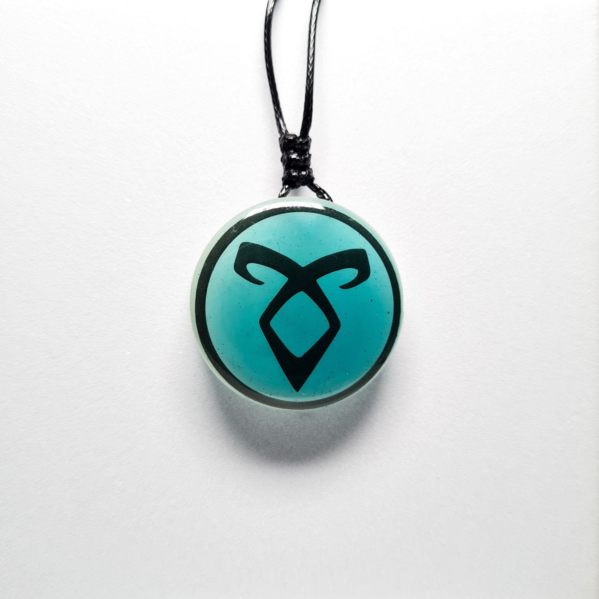 The Enkeli Blue Glow in Dark Resin Handcrafted Pendant